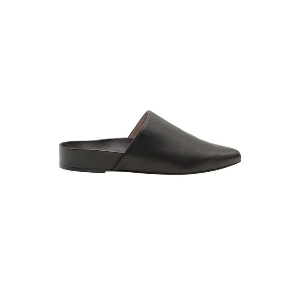 Stuart Weitzman Flat Mules in Black Leather
